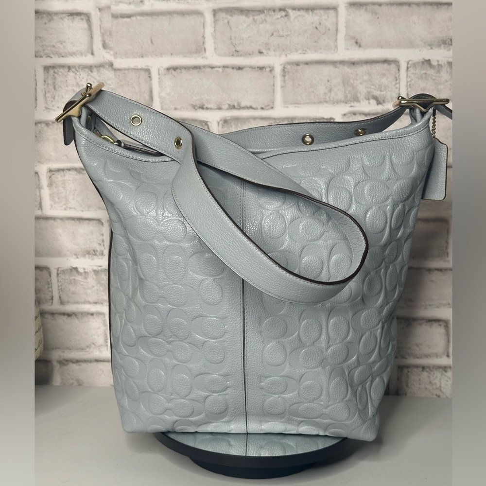Coach Legacy Signature Embossed Leather Duffle
Bag Light Blue gold-tone hardware